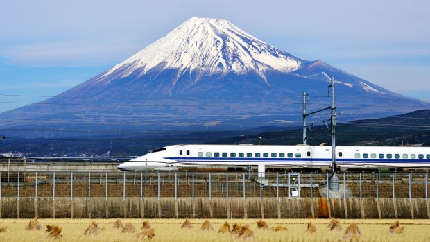 A bullet train passes below Mt. Fuji in Japan.