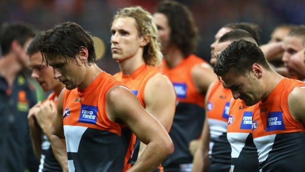 Shattered: Giants players looks dejected after being defeated by the Western Bulldogs.