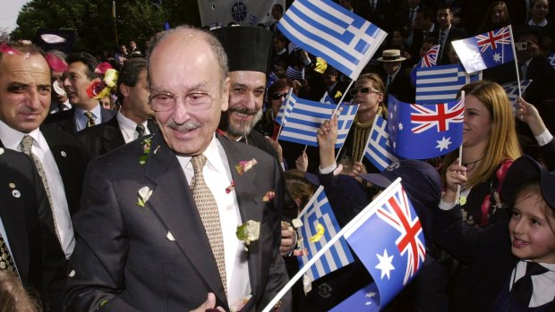 President of Greece Constantine Stephanopoulos meets school children, waving Greek and Australian flags at the Greek Orthodox Archdiocese in Sydney, 2002.