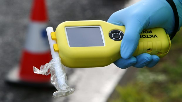 A police officer was almost hit by a car at a breath testing site in Wodonga.