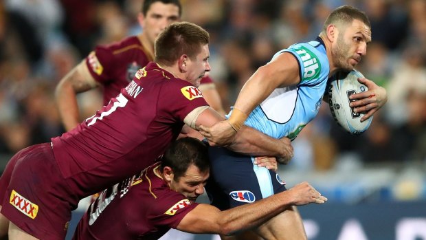 State against state: Robbie Farah is tackled during game three of the State Of Origin series, which will head to Perth in 2019.