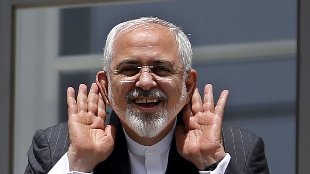 Iranian Foreign Minister Mohammad Javad Zarif gestures as he talks with journalists in Vienna where the deal was reached. 