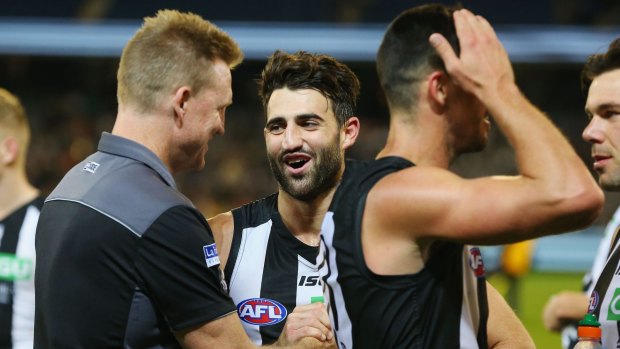 Magpie Alex Fasolo with his coach Nathan Buckley.