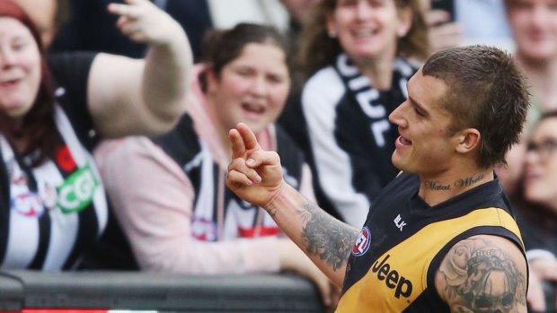 Dustin Martin gives a two-fingered salute to the crowd during the weekend's match against Collingwood