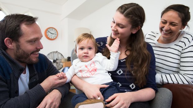 Au pair Annika Abraham with her host family Matthew Eglan, Amanda Buckland and one-year-old Lucy, in their Sydney home. 