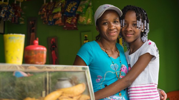 Judith Blandon Ramirez with her youngest daughter Ana Sofia Blandon in her shop in Medellin, which she describes as the best city in the world.