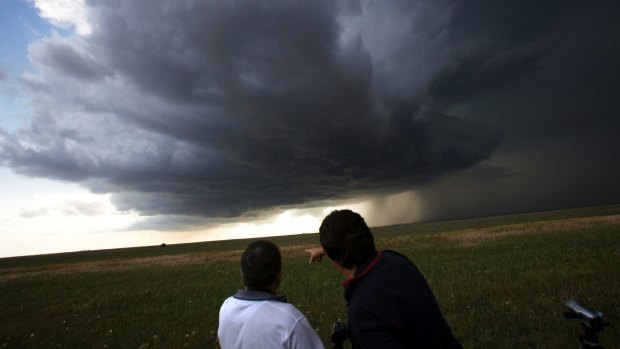 Storm chasers Jimmy Deguara and Michael Bath watch a supercell create a wall cloud and almost produce a tornado.