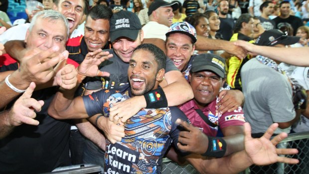 Mobbed: Preston Campbell is hailed by jubilant fans after the inaugural Indigenous All Stars match in 2010.