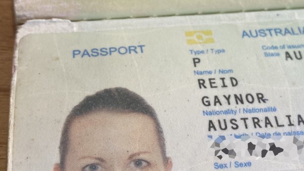 The small tear at the top left of Gaynor Reid's passport photo page was the problem.