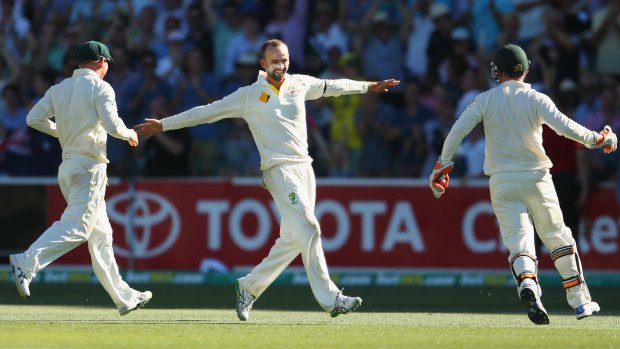 Memorable win: Nathan Lyon celebrates after the final wicket in Adelaide last year.