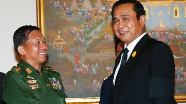 Myanmar's Chief Senior General Min Aung Hlaing , left, shakes hands with Thailand's Prime Minister Prayuth Chan-ocha in Bangkok in August.