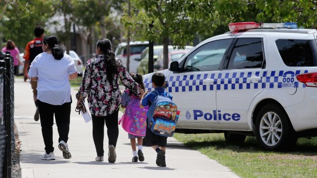 Parents take their children from a school in Craigieburn after a threat was made this week. 