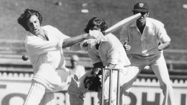 Max Walker attempts to sweep NSW bowler David Hourn during a Sheffield Shield match at the SCG in 1976.