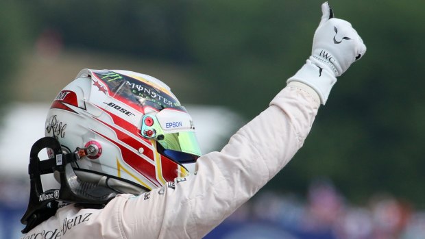 Just like that: Mercedes driver Lewis Hamilton celebrates after putting his car on pole.