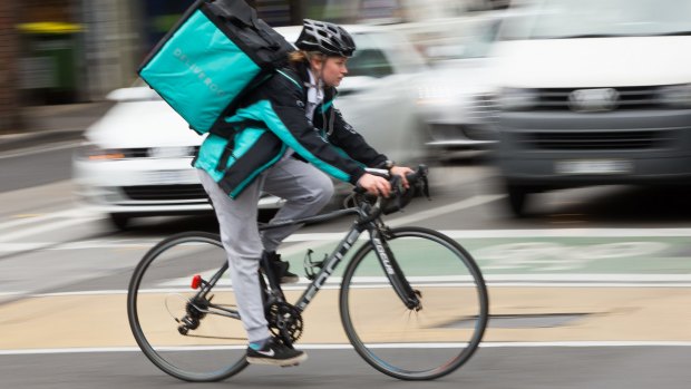 A Deliveroo driver in a previous version of the uniform.