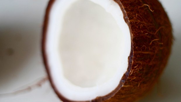 Coconut oil's saturated fat raises cholesterol in the same way as butter and palm oil, the AHA says.