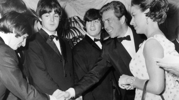 Britain's Princess Margaret with Lord Snowdon, second from left, as he shakes hands with Ringo Starr when meeting the Beatles before the premiere of <i>Help</i>, at the London Pavilion, in London.
