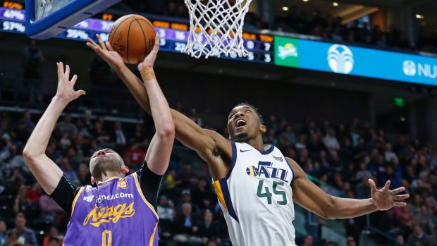 In need of a big man ... Sydney Kings centre Isaac Humphries in action against Utah Jazz guard Donovan Mitchell.