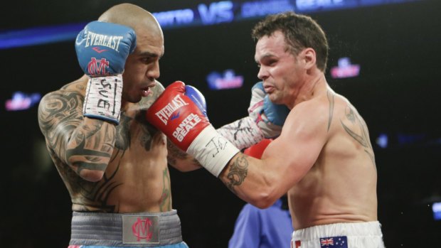 Trading blows: Puerto Rican champion Miguel Cotto hits Daniel Geale with a left during the first round in New York. 