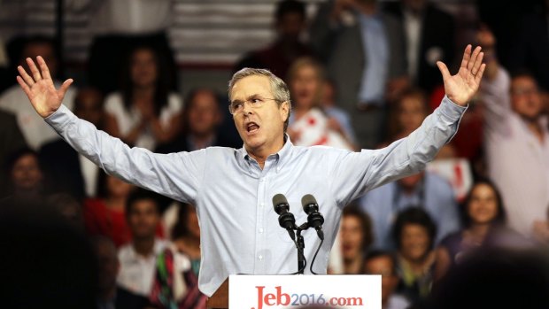 Former Florida Governor Jeb Bush waves to the crowd as he formally joins the race for president.