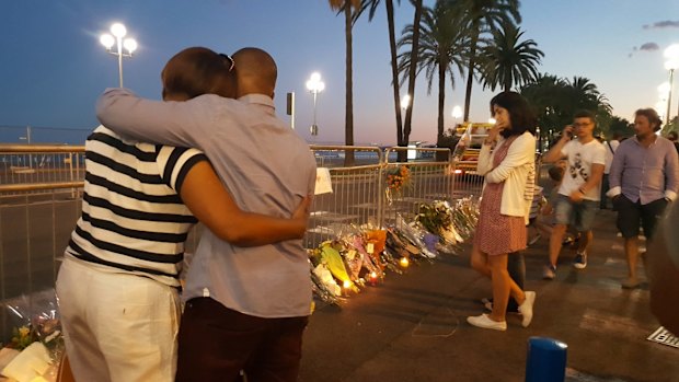 People join the tributes on the Promenade des Anglais in Nice.