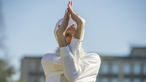 Canberrans participate in an outdoor yoga class to mark the official International Day of Yoga.