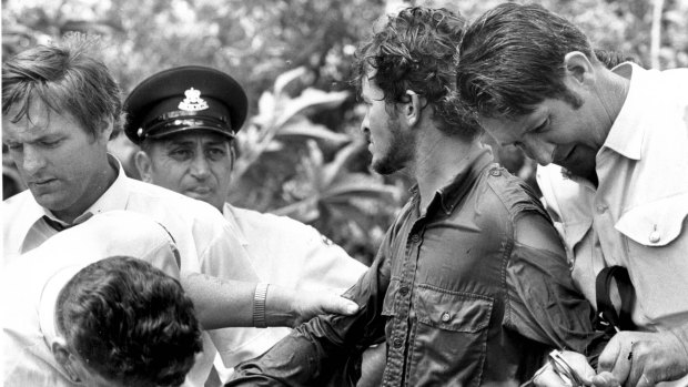 Allan Baker, surrounded by police after his capture in 1973.