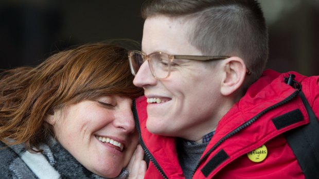 Roz Ward is hugged by a supporter on her return to work at La Trobe University in June. 