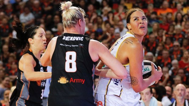 The Boomers' Liz Cambage drives to the basket against Townsville in the opening game of the grand final series.