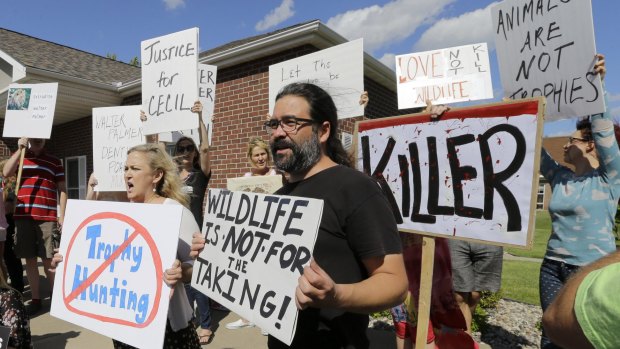 Protesters outside Walter Palmer's dental office in Bloomington, Minnesota.