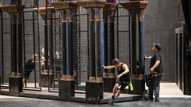 Stagehands move one of the sets from <I>La Traviata</I>. 