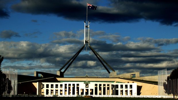 The Australian flag atop Parliament House in Canberra. Debate over whether the date of Australia Day should be changed has divided the nation. 