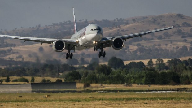 A Qatar Airways plane landing at Canberra airport.
