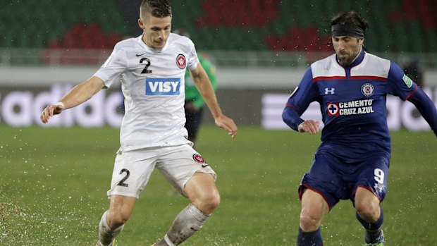 Going in hard: The Wanderers' Shannon Cole battles with Cruz Azul's Mariano Pavone in Rabat.