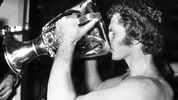 Richmond's Barry Richardson drinks from the premiership cup in 1974.