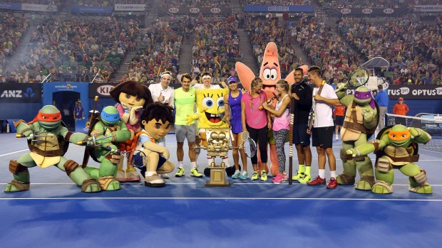 Nick Kyrgios, dressed in black, has fun with Roger Federer, Ana Ivanovic, Victoria Azarenka, Eugenie Bouchard and Thanasis Kokkinakis  during the Rod Laver Arena Spectacular as part of Kids Tennis Day on Saturday.