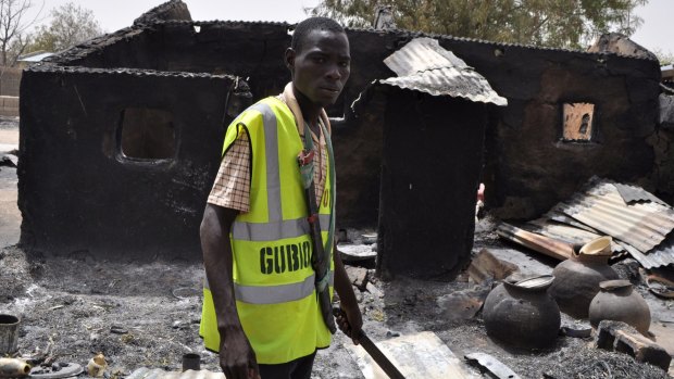 Boko Haram continues to wreak havoc across Nigeria. A local man is pictured here after an attack in the north-eastern town of Gubio last week that left 37 people dead and more than 400 buildings destroyed by fire.
