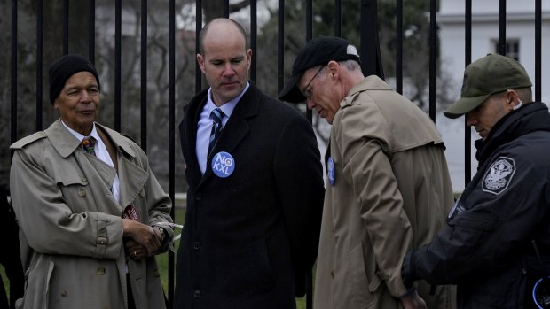 Bill McKibben (black cap) was among activists arrested outside the White House in 2013 protesting against the proposed expansion of the Keystone oil pipeline. Two years later, the expansion was canned.