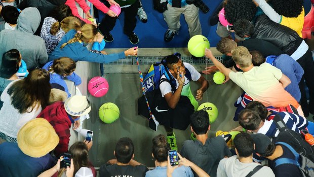 Nick Kyrgios mobbed after his win at the Australian Open.