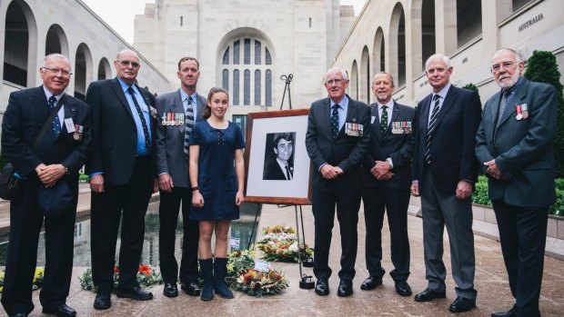 The last post ceremony for Terrance Langlands at the National War Memorial. (L-R) Members of Langlands' class Ian Kelly, Greg Monteith, Mick Woolan, David Gray, Terry Wesley-Smith and Ian Paton with Langlands' nephew David Langlands with his daughter Amber Langlands.