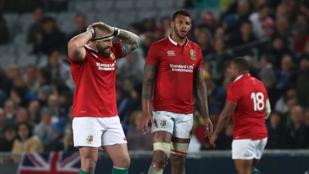 Red alert: Courtney Lawes of the British and Irish Lions and teammates come to terms with defeat against the Blues at Eden Park.