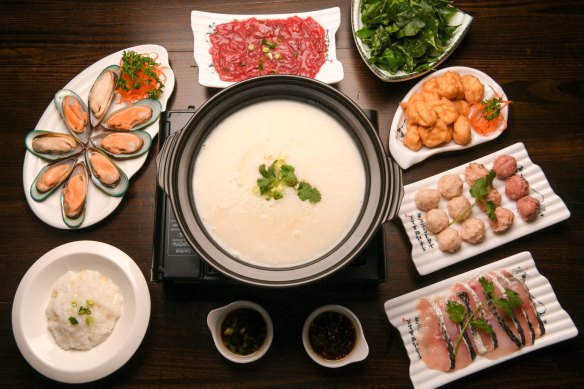 Shunde-style porridge base hotpot with seafood, sliced beef and delicate fish and pork balls. 