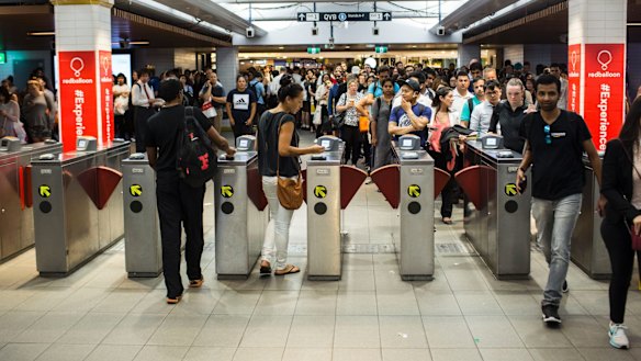 Commuters wait to enter Town Hall station, more than 12 hours after a fatality in the city's outer west. 
