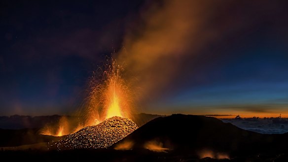 Molten lava erupts from the Piton de la Fournaise, one of the world's most active volcanoes, on Saturday.