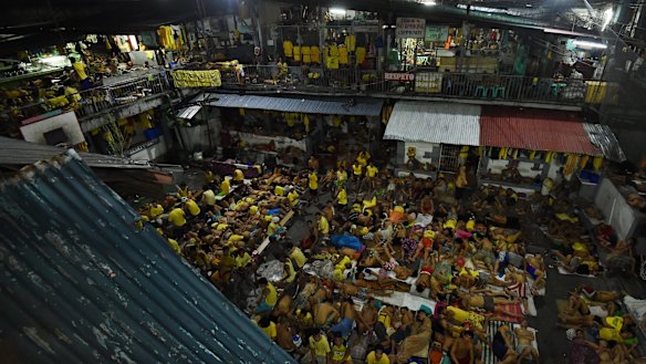 Some of the 3562 inmates sleep on any available space on the basketball court in jail in Manila, Philippines. The congestion is due to the war on drugs.