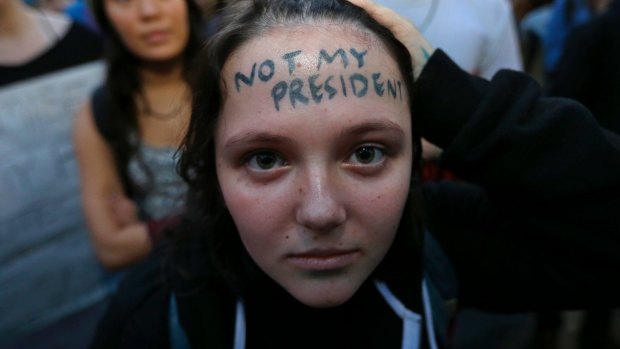 Clair Sheehan has the words "Not My President" written on her forehead as she takes part in a protest in Seattle.