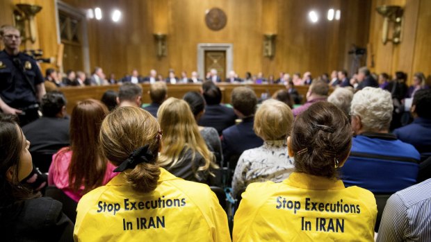 Protesters sit in the audience during the Senate foreign relations committee meeting on the Iran Nuclear Agreement Review Act of 2015. 