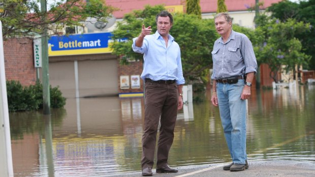 Warrego MP Howard Hobbs, pictured surveying floods in 2010 with then opposition leader Lohn-Paul Langbroek, is planning to retire.
