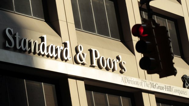 Standard & Poor's lowered the credit ratings of 23 institutions on Monday.