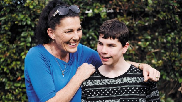 Ally McLeod with her son Connor McLeod, a 15-year-old who was born blind and convinced the Reserve Bank to introduce tactile banknotes. 

